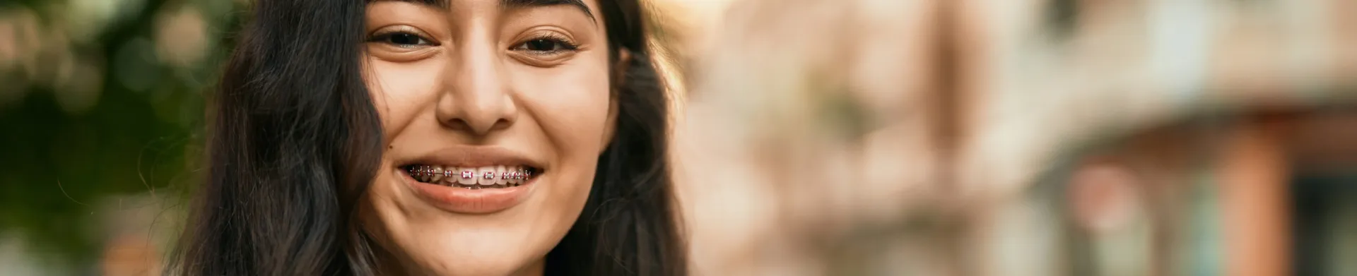 Adult smiling with braces