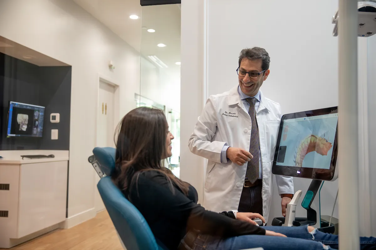 Dr. Mawaldi consulting with patient at LifeSmile Orthodontics
