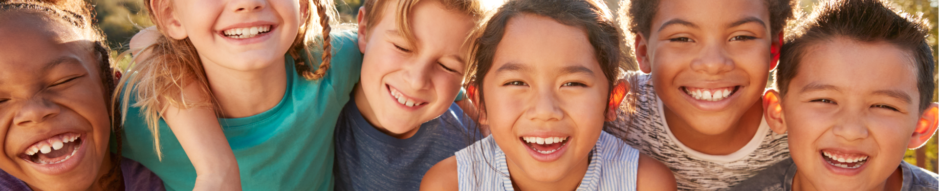 Kids with Invisalign and braces smiling