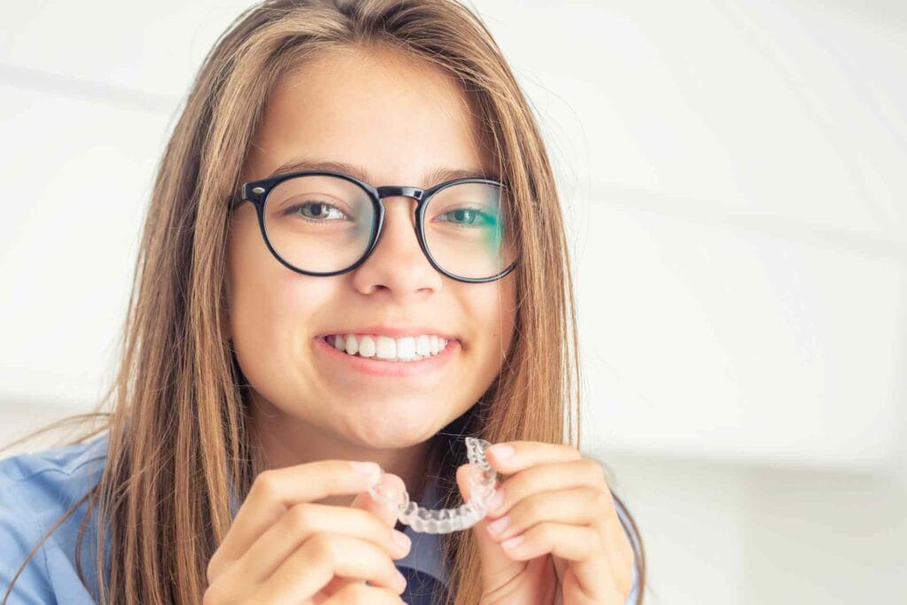 Girl Smiling with Clear Aligner
